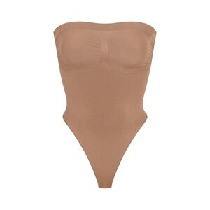 SKIMS Strapless Thong Bodysuit in Sienna